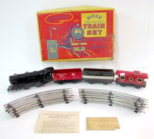 Marx Mechanical Sparkling Train Set: Marx Mechanical Sparkling Train Set: in original box; tin litho; with 8 pieces of track. Engine, New York Central; Pennsylvania coal car; New York Central caboose. With instruction sheet and locomotiv