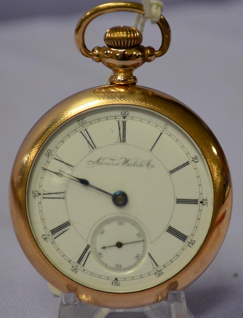 Aurora 18S 15J OF PS GF Full Gilt No. 39381 Pocket: Aurora 18S 15J OF PS GF Full Gilt No. 39381 Pocket Watch. Running. In a yellow SF&B SWCCO 20yr case No. 3234624. The machined case back has some scuffing. The SSD has a hairline. Crystal scuffed.