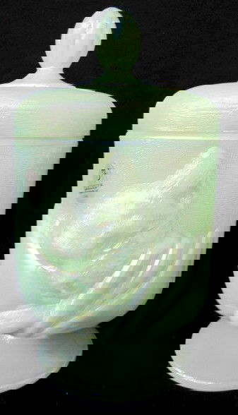 Fenton 1998 Covered Jar w/Cat: Fenton 1998 Covered Jar w/Cat: iridized and textured opaque green glass with sleeping cat on the front. 8" All items sell As Is, Where Is, no guarantees of any kind. We accept Mastercard & Visa, no pa