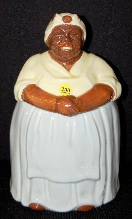 Pottery Black Mammy Cookie Jar: Pottery Black Mammy Cookie Jar: unmarked. No condition problems. 13" All items sell As Is, Where Is, no guarantees of any kind. We accept Mastercard & Visa, no paypal, no personal checks, no money ord
