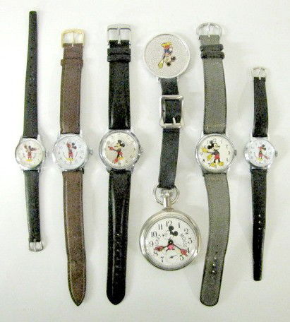 5 Mickey Mouse Wrist Watches & 1 Pocket Watch: 5 Mickey Mouse Wrist Watches & 1 Pocket Watch: 1.) Made by Helbros, he is on the silver dial using arms as time indicators and with a seconds hand. Stainless steel. 2.) Walt Disney Productions, Mickey