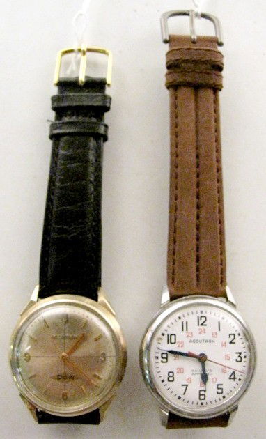 2 Bulova Accutron Wrist Watches: 2 Bulova Accutron Wrist Watches: 1.) 214, circa 1967, No.C31336. Stainless steel with 14K gold filled bezel. The gold dial has gold features; presentation on back, Dow Chemical Co. 1968 to a 30 yr emp