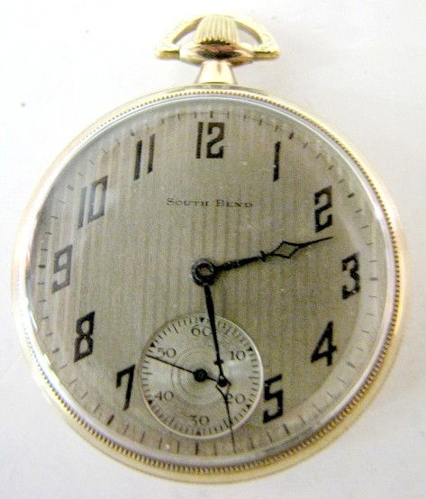 South Bend 411 17J 16S OF GF Pocket Watch: South Bend 411 17J 16S OF GF Pocket Watch: serial no.985661. In a yellow screw back 20yr South Bend case, numbered 177250. (The lined and silvered dial has some wear. The case back has that buffed loo