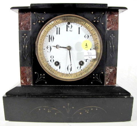 Seth Thomas Slate Mantle Clock: Seth Thomas Slate Mantle Clock: 8 day time with gong strike and porcelain 4 1/2" dial. In black slate case with brown marble and incised designs. (Both springs are tight. Some edges have small chips.)