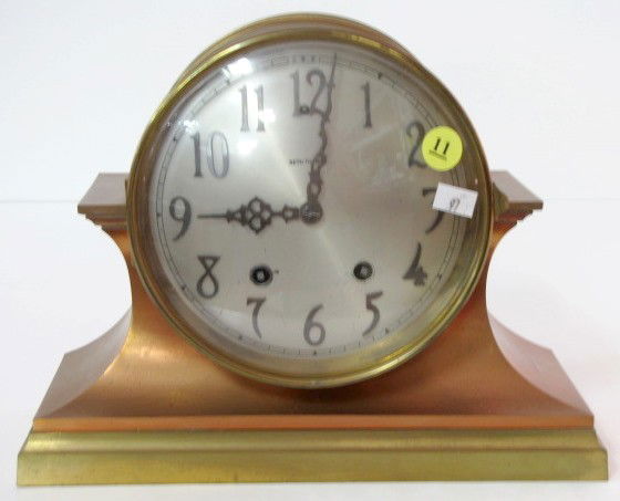 Seth Thomas Colossal Mantle Clock: Seth Thomas Colossal Mantle Clock: cast metal copper and brass with convex 8" silvered dial. 8 day time with half hour gong strike. (Both springs are nearly tight, runs and strikes.) 8 1/2" x 10 3/4"