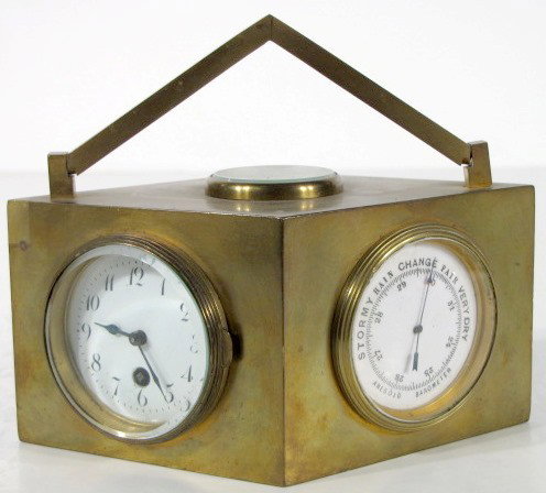 Diamond Shaped Brass Multi-Funciton Desk Clock: Diamond Shaped Brass Multi-Function Desk Clock: with swing handle and a compass on top. Around the case is a clock, Aneroid barometer, Centigrade thermometer and a Fahrenheit thermometer. Everything i