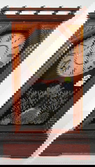 Seth Thomas Omaha City Series Clock: Seth Thomas Omaha City Series Clock: 8 day time with gong strike and original 6" dial. (The dial has some stains. There are a multitude of small indentations on the door's lower edge and the case belo