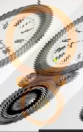 E. Ingraham Ionic Wall Clock: E. Ingraham Ionic Wall Clock: 8 day time with gong strike and a new 10" dial. In a rosewood and veneered case with excellent interior label. 21 1/2", not hung or tested at this time All items sell As