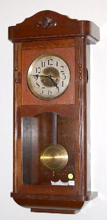 14 Day Carl Pruler, Germany Wall Clock: 14 Day Carl Pruler, Germany Wall Clock: 14 day Cloria movement with gong strike, 1/2 hour at noon and six. In a mahogany case with 7" silvered dial. 31" and running at this time All items sell As Is,