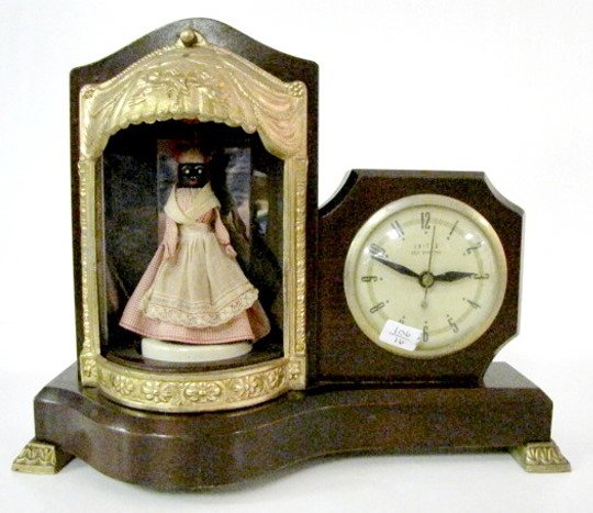 United Electric Animated Musical Mammy Clock: United Model 870 Electric Animated Musical Mammy Clock: United Self Starting with revolving Mammy in a red checkered dress. Her apron has Souvenir of New Orleans on the edge. The light works. (She doe