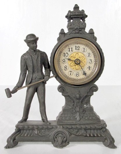 Novelty Clock Man With a Hammer: Novelty Clock - Man With a Hammer: the case is made of good white metal with a fixed key wind clock movement. The fancy dial is 2 1/2" wide. No makers information found. Looks like it was made to comm