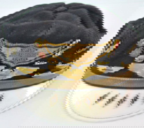 Vintage Harley Davidson Hat w/Badges: Vintage Harley Davidson Hat w/Badges: the name Donly is in individual diamonds on the white bill. A stitched emblem and 13 metal pins are above the bill. There are several Harley and 1 Indian wings of