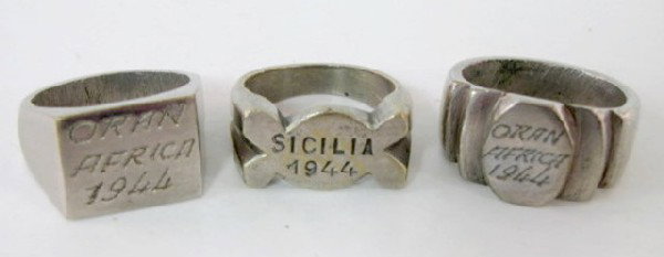 Group of 3 WWII Trench Art Rings: Group of 3 WWII Trench Art Rings: 2 of the 3 have very visible hand filing marks inside. All are silver or stainless colored metal. 1.) Engraved on front ORAN AFRICA 1944. It is size 11. 2.) Also ORAN