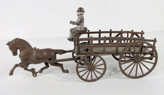 Cast Iron & Steel Hay Wagon & Horse: Cast Iron & Steel Hay Wagon & Horse: unmarked; large cast metal spoke wheels; sides of wagon and driver; steel plate wagon bed; single horse hitch with horse. (Driver may not be original, he is wired