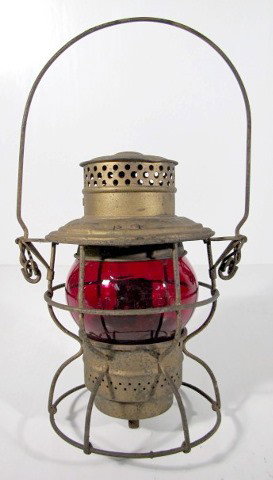 C.M. & St. P. Ry Red Railroad Lantern: C.M. & St. P. Ry (Chicago Milwaukee & St. Paul Railway) Red Railroad Lantern: top marked C.M. & St. P. RY Adlake No.250 Kero The Adams & Westlake Co. New York, Chicago, Phila., red globe embossed Adla