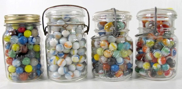 4 Glass Jars of Colored Marbles: 4 Glass Jars of Colored Marbles: mixture of solid; 2 color and 3 color. Not sorted, age unknown. All items sell As Is, Where Is, no guarantees of any kind. We accept Mastercard & Visa, no paypal, no p