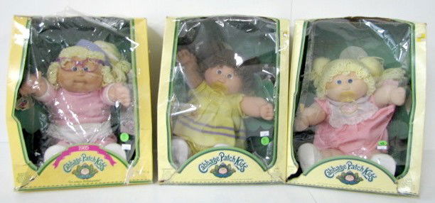3 Cabbage Patch Kid Dolls: 3 Cabbage Patch Kid Dolls: all in original boxes. Blonde, blue eyed girl with pacifier and certificate; blonde, blue eyes girl with lavender glasses and certificate; brunette, blue eyed girl with paci