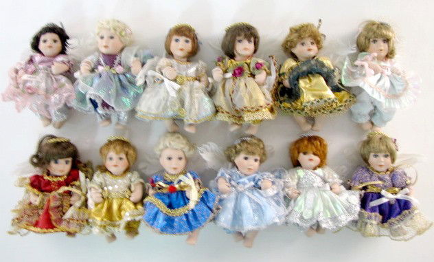 12 All Bisque Monthly Angel Dolls: 12 All Bisque Monthly Angel Dolls: all bisque with glass eyes, painted lips and angel wings. January, February, March, April, May, June, July, August and September have a ribbon with the month on them