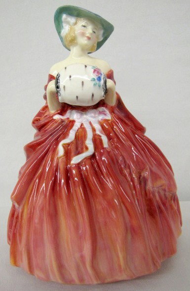 Royal Doulton "Genevieve" HN1962 Figurine: Royal Doulton "Genevieve" HN1962 Figurine: green stamped marks include title only with painted HN No. and initials HC. In a red gown and blue hat with white muff. 7 1/4" All items sell As Is, Where Is