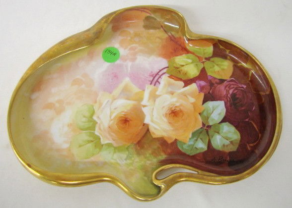 Coronet, Limoge France Flat Dish w/Roses: Coronet, Limoge France Flat Dish w/Roses: the roses are in 3 colors on a multicolor background. The Coronet, Limoge France blank is an odd shape. 1" x 10 1/2" x 7 3/4" All items sell As Is, Where Is,