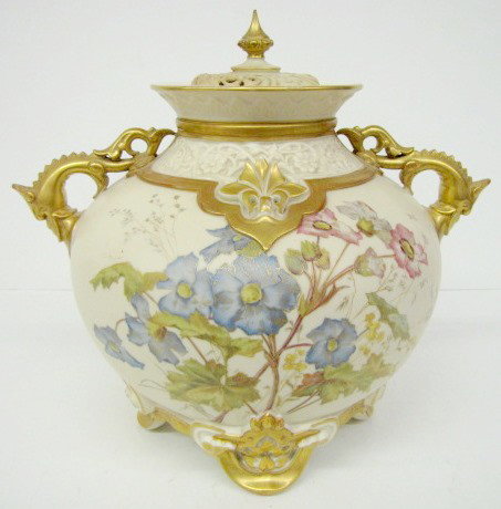 Royal Worcester Covered Vase w/Dragon Handles: Royal Worcester Covered Vase w/Dragon Handles: under the rim is a band of molded floral and scroll designs. The large body stands on 4 feet and is painted with large blue and pink flowers with green l