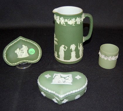 4 Wedgwood Jasperware Items, White on Green: 4 Wedgwood Jasperware Items, White on Green: all have classical scenes; all marks include England. 1.) Dark green jug, 6 3/8". 2.) Light green heart box, 5". 3.) Short cylinder shape with grapes, 2 1/