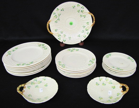22 Irish Belleek Shamrock Plates w/Black Mark: 22 Irish Belleek Shamrock Plates w/Black Mark: all are with the 3rd black mark and have basket weave backgrounds. 7- 8 3/8" plates; 6- 6 1/2" plates; 6- 5 1/4" plates; 1 cape plate with handles, 10 5/