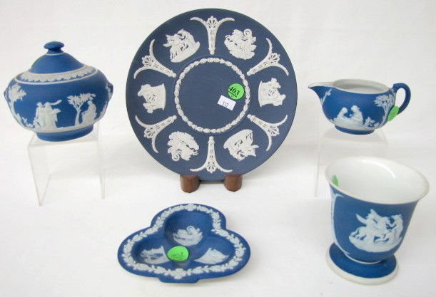 5 Wedgwood Jasperware Items, White on Dark Blue: 5 Wedgwood Jasperware Items, White on Dark Blue: all marks include Made in England. 1.) Large egg shaped cup, 3 1/2" x 3 1/4". 2.) Cream jug, 2 1/4". 3.) Covered sugar with missing handles, 4". 4.) Cl