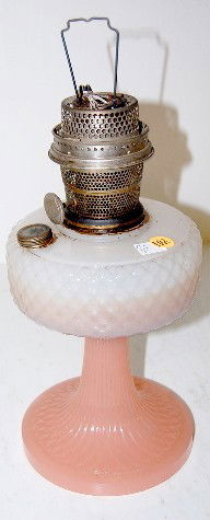Aladdin B-91 Moonstone Kerosene Lamp: Aladdin B-91 Moonstone Kerosene Lamp: white moonstone font on a rose moonstone foot. Mounted with a Model B Nu-type burner. The burner is complete, there is no chimney. (There is fuel residue in the f