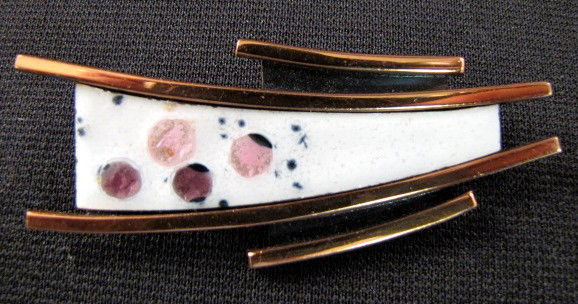 Renoir "Matisse" Enameled Brooch: Renoir "Matisse" Enameled Brooch: made of copper bars with a black surface between, in short bars and center. The elongated center has white enamel pink rounds and black dots on the lower half. Well m