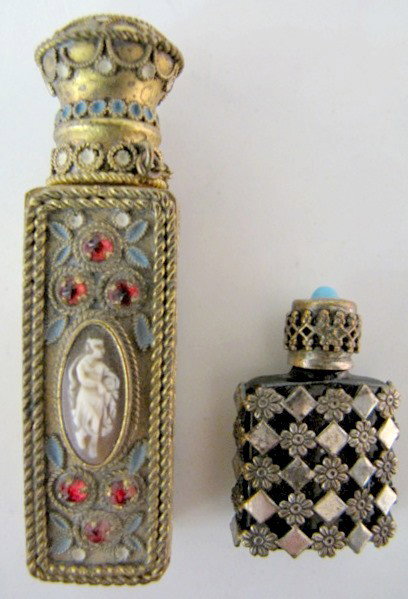 2 Made in France Scent Vials: 2 Made in France Scent Vials: 1.) Fancy pressed brass with enamel, cameo and red stones. A small, clear bottle with stopper fits inside. A red stone is on the cap and another on the bottom. There are 