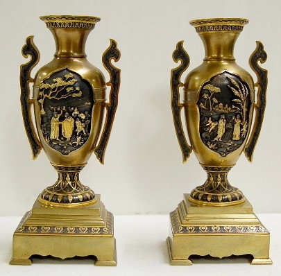 Pair Arabian Scene Bronze Vases w/Silver & Gold: Pair of Arabian Scene Bronze Vases w/Silver & Gold: the handle and decorative medallions are applied; both have Arabian scenes, one is 2 men shaking hands, a tree is near them, a camel caravan with ri