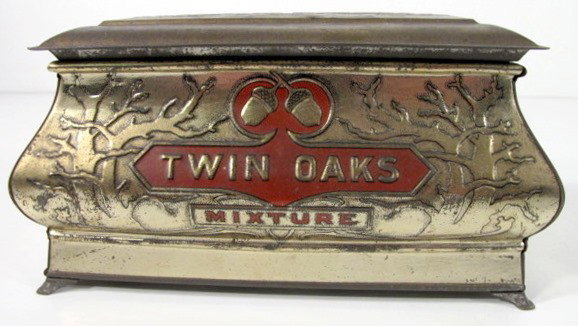 Tin Twin Oaks Tobacco Chest w/Embossed Designs: Tin Twin Oaks Tobacco Chest: red and gold colors with embossed designs. Made as a humidor. (There is some wear.) 4 1/2" x 8 1/2" x 4 1/4" All items sell As Is, Where Is, no guarantees of any kind. We 