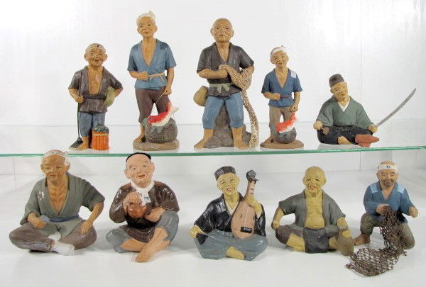 10 Japanese Hakata Clay Figures: 10 Japanese Hakata Clay Figures: 1.) Standing man with fish on a basket, 9 1/4". 2.) Standing man with fish net. Marked with a Wales sticker. 8 1/2" 3.) Standing man with fish on a basket. He is marke