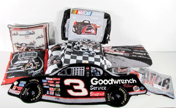 Group Lot of Dale Earnhardt Cloth Collectibles: Dale Earnhardt Cloth Collectibles: 6-7 pillow cases; duffel bag; bedding; coverlet; car shaped rug and 2 pillows. (Some as used; some new.) All items sell As Is, Where Is, no guarantees of any kind. W