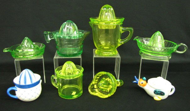 8 Colored Glass & China Reamers: 8 Colored Glass & China Reamers: 1.) Vaseline colored handheld reamer. 2.) Vaseline colored lemon/orange reamer with matching measuring cup style base with a lemon on one side and orange on the other.