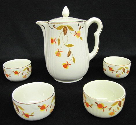 5 Pieces Hall Tealeaf Kitchenware: 5 Pieces Hall Tealeaf Kitchenware: coffee pot, no center, marked on bottom (hairline across spout on one side; chip to inner rim); 4 custard cups, each marked, no condition problems. Tallest 9 1/2" Al