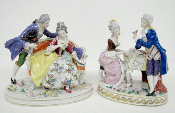 German & Other Porcelain Courting Couple Figures: German & Other Porcelain Courting Couple Figures: 1.) Marked Germany with crown S; she is playing a piano, he is flirting with her. 2.) Unmarked, she is sitting on a loveseat being coy, while he appea