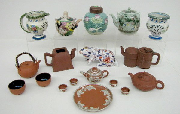 11 Oriental & Italian Teapots & Other: 11 Oriental & Italian Teapots & Other: 1.) Gaudy style decorated rabbit figurine. 2.) China crane and water lily decorated tea jar with wood lid. 3.) Japan terra cotta teapot and 2 matching cups. 4.) 