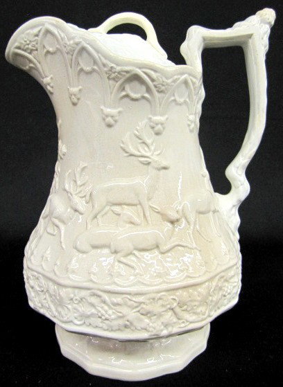 Cork & Edge Relief Moulded Stag & Holly Pitcher: Cork & Edge Relief Moulded Stag & Holly Pitcher: stamp marked; Cork & Edge pearl white Ironstone, has lid; E. Pluribus Unim. Ref: R.K. Henrywood Relief Moulded Jugs, Page 194, Plate 228. (Discolored; 
