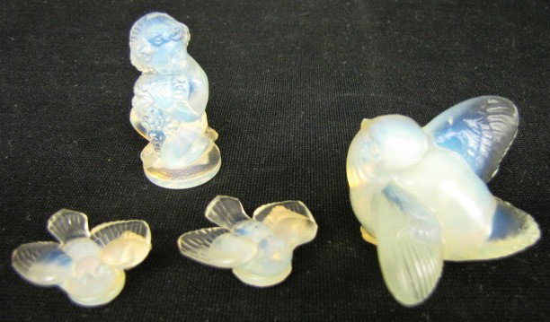 4 Sabino Glass Novelty Items: 4 Sabino Glass Novelty Items: 1.) Kneeling child with flowers, marked on bottom. 2.) Bird with wings spread; embossed Sabino France and paper label "Made in France". 3.) 2 small birds with wings sprea