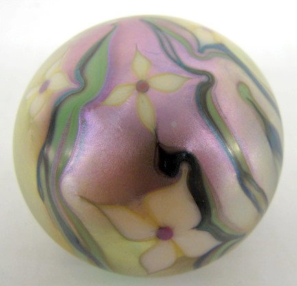 Signed Orient & Flume Art Glass Paperweight: Signed Orient & Flume Art Glass Paperweight: yellow with green stems and yellow flowers with a rosy pink iridized top. 317 F 1976 with original paper; cloth bag and box. All items sell As Is, Where Is
