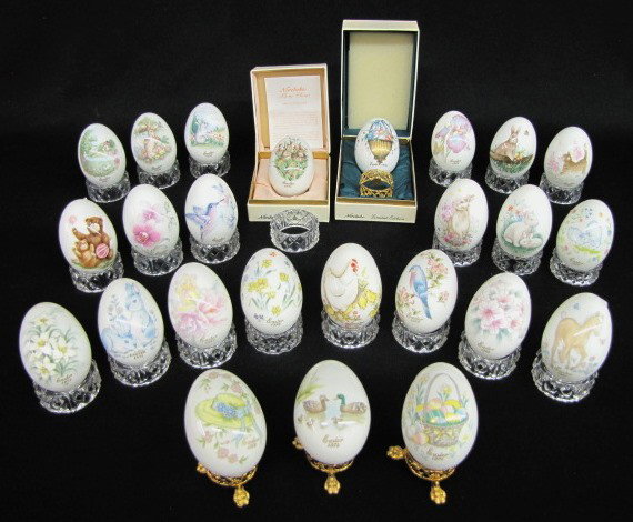 Group of 25 Noritake Bone China Easter Eggs: Group of 25 Noritake Bone China Easter Eggs: Easter 1971 through 1995; decorated with a variety of flowers, animals and birds. 21 plastic rings to set them on and 4 metal footed rings. 2 in original b