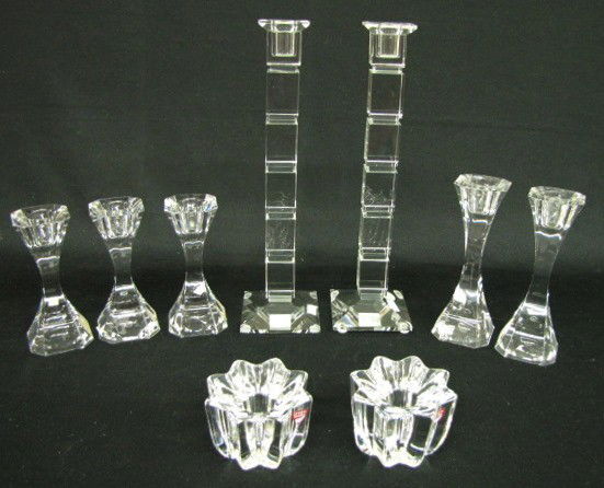 9 Glass Villeroy & Boch & Other Candleholders: 9 Clear Glass Villeroy & Boch & Other Candleholders: 1.) 5 Villeroy & Boch; 3 marked. 2- 6 1/2"; 3- 5 1/4" 2.) Pair of ribbed labeled Orrefors, Sweden, 2 1/8". 3.) Pair of tall rectangular cube pillar