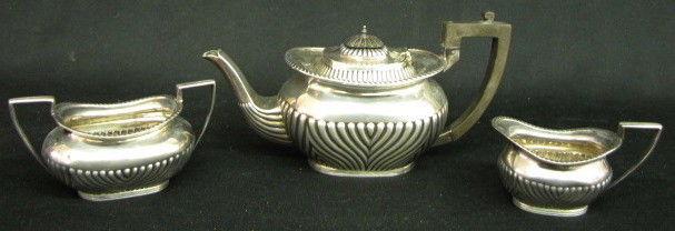 Hallmarked 3 Piece Sterling Silver Tea Set: Hallmarked 3 Piece Sterling Silver Tea Set: marked J D & S, crown, lion and C; teapot, cream and sugar; lid on teapot also hallmarked. (Small dent on sugar.) Tallest 5" All items sell As Is, Where Is,