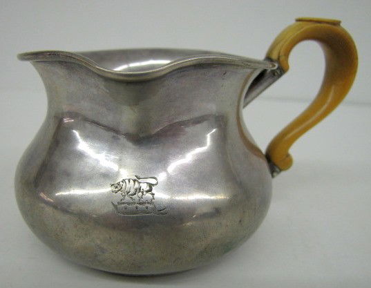 Hallmarked Sterling Silver Engraved Pourer: Hallmarked Sterling Silver Engraved Pourer: marked WJ; hallmark hard to make out; engraved with a bull on a crown like object; handle looks to be bone?? (Small dent on back side.) 3 1/4" All items sel