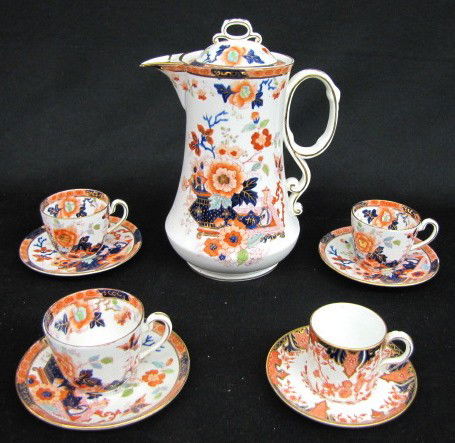5 Piece English China Demitasse Set: 5 Piece English China Demitasse Set: 1.) Pot, 3 cups and 3 saucers marked RS "Freda" with cobalt and orange decoration. 2.) Tea cup and saucer marked Royal Crown Derby, England; same colors. No condit