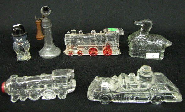 Group of 6 Vintage Glass Figural Candy Containers: 6 Vintage Glass Figural Candy Containers: 1.) Unmarked stick phone with metal mouthpiece and wooden receiver. 2.) Round headed man with painted features and a bowler cap. 3.) Fire engine, no closing p