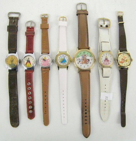 Group of 7 Disney Character Wrist Watches: Group of 7 Disney Character Wrist Watches: 1.) Disney Alice in Wonderland with Alice standing in or behind a large pink flower; brown strap. (Crystal is scratched.) 2.) Bradley Cinderella in blue dres