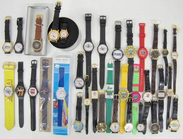 Group of 34 Advertising Wrist Watches: 34 Advertising Wrist Watches: includes Benjamin Moore Paints; Allied Building Materials; Blockbuster Video; U.S. West; Scrubbing Bubbles; Wal-mart and others. Some are in original packaging, most are 